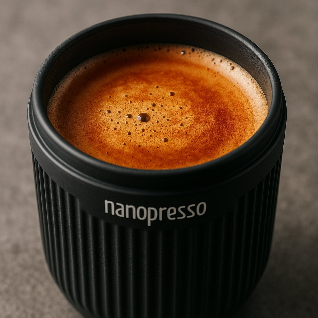 Nanopresso coffee quality and crema close-up in a travel cup
