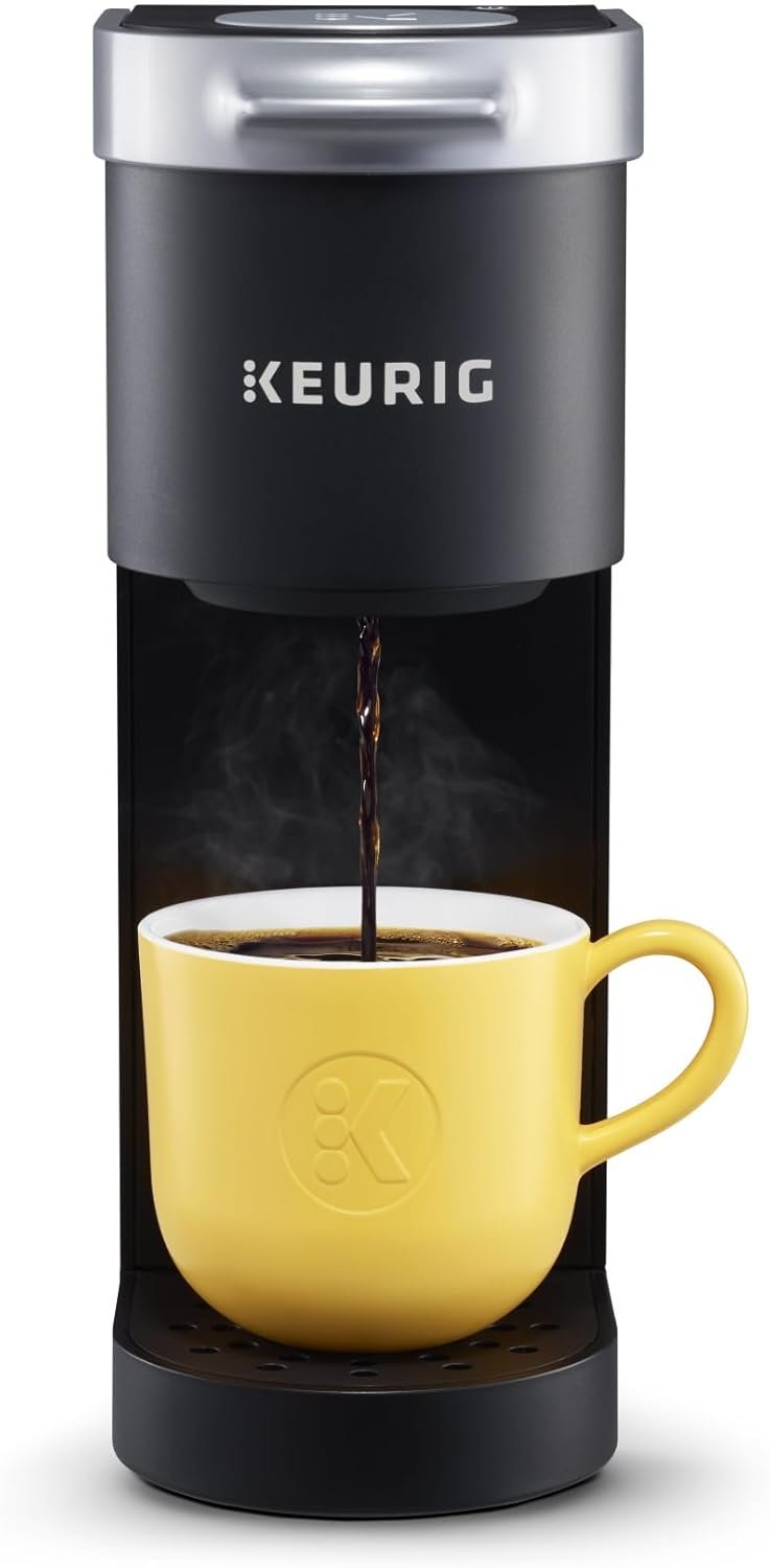 Keurig K-Mini Coffee Maker Review Keurig K-Mini single serve coffee maker on a countertop with ceramic mug
